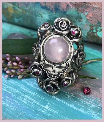 rose quartz skull with ruby roses