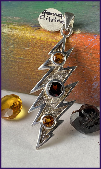 sterling silver bolt pendant with garnet and citrine stones